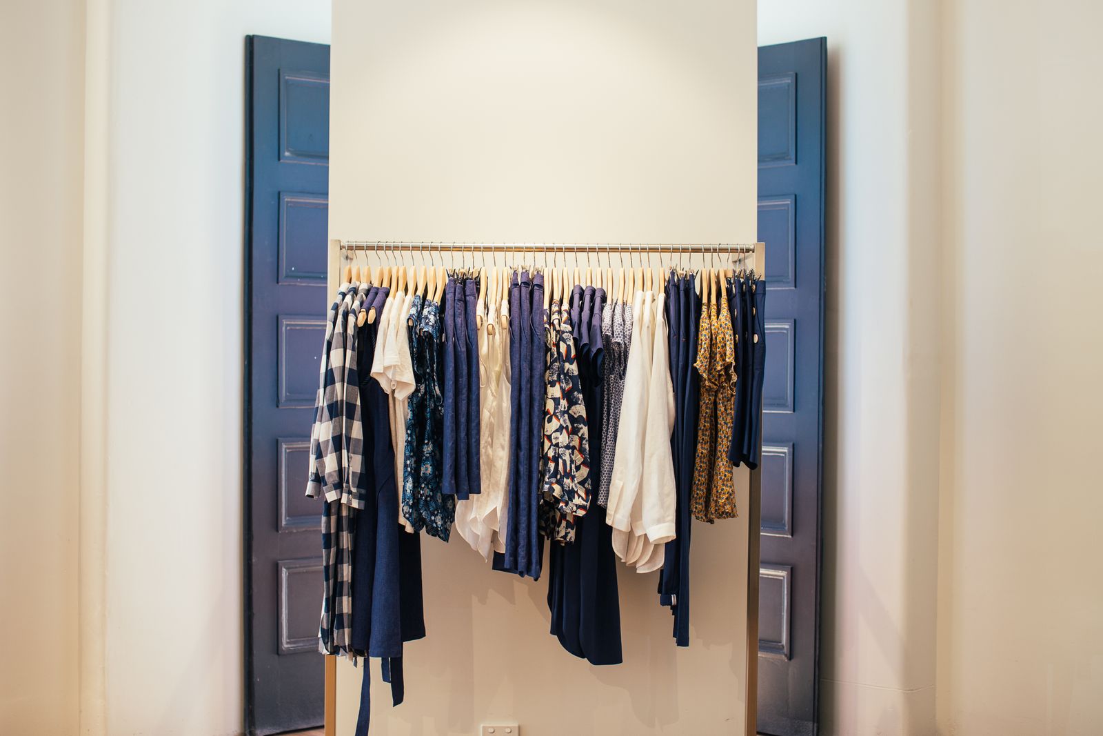 An airy wardrobe with neatly arranged clothing